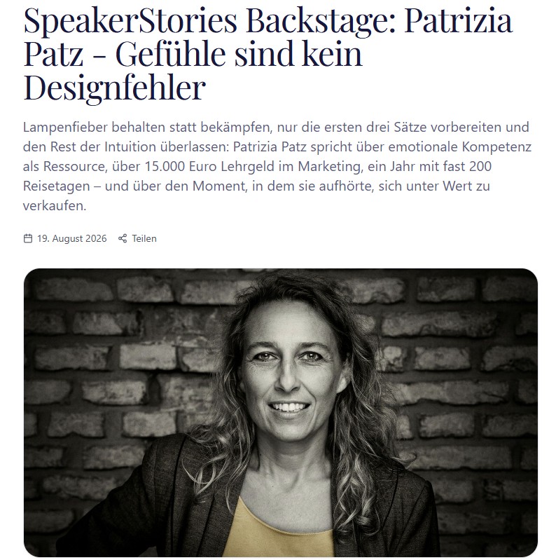 Speakerstories - Patrizia Patz Black-and-white portrait of a smiling woman in a blazer posed against a brick wall, used as the header image for the interview feature.